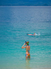 beautiful girl in a bathing suit with a mask and snorkel