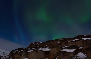 Fototapeta na wymiar Unusual natural phenomena in the night sky - aurora