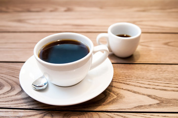 A cup hot americano coffee on wood table