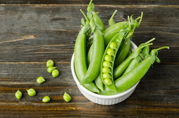 Fresh green pea on wooden background