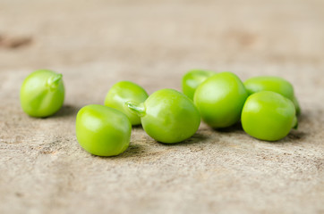 Fresh green pea on wooden background
