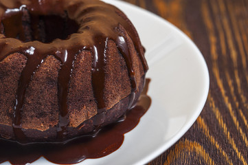 Chocolate cake  with glaze on the white plate