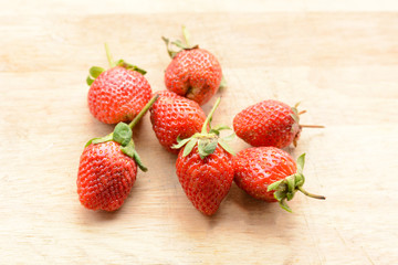 Strawberry on a wooden floor.