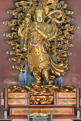 Golden statue on an altar at Lama Temple, Beijing