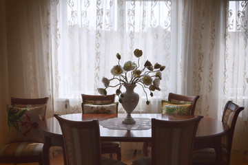 classic interior dinning room with vase and table
