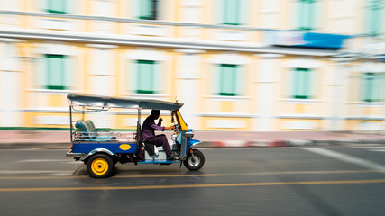 Tuk-Tuk in motion blur. (Tuk-Tuk is the name of Thailand style taxi. You can see many Tuk-Tuk at Bangkok, Thailand)