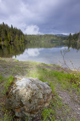 Fototapeta na wymiar Scenic Reflections in Champion Lake, BC, Canada