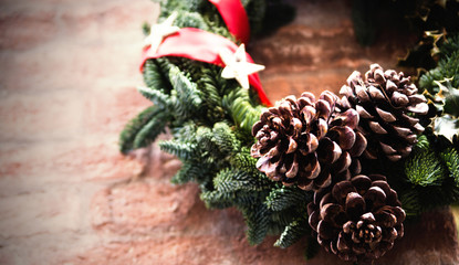 Christmas Wreath  isolated on red brick wall