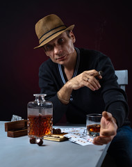 man with whiskey and cigar