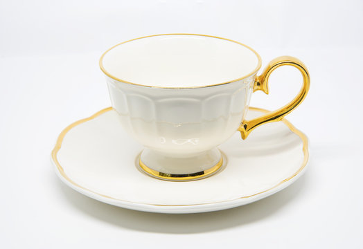 Antique porcelain tea cup on white background