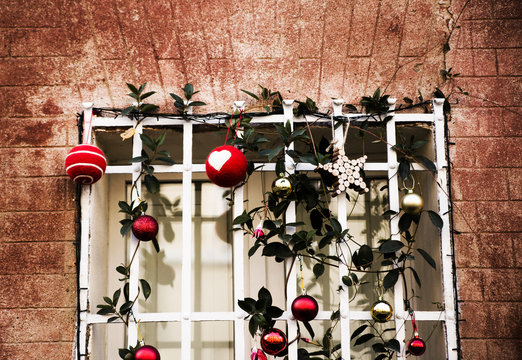 Christmas street decorations with brick wall