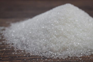 White sugars on a wood table