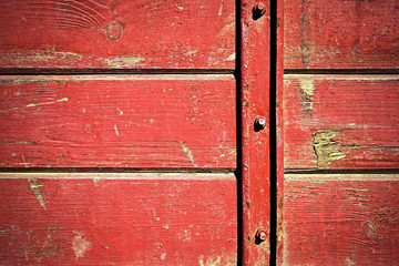 Red wooden slabs connected by iron