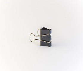 Black paper clip, isolated on white background