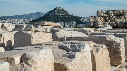 Ruins atop the Athens Acropolis with Lycabettus Hill