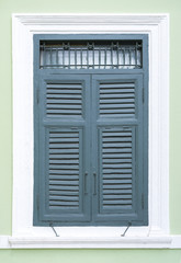 Fototapeta premium old blue window made out of wood on white wall