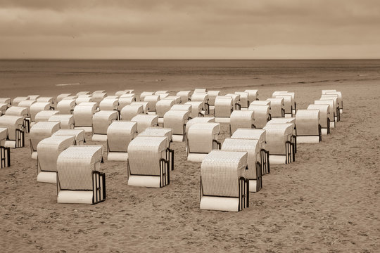 Roofed beach chairs chairs on the strand, island Ruegen, Mecklenburg-Vorpommern, Germany, /sepia tone/