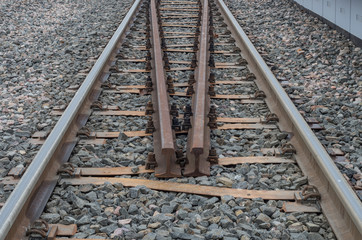 Railway track on gravel embankment, with ypsilon steel railway ties