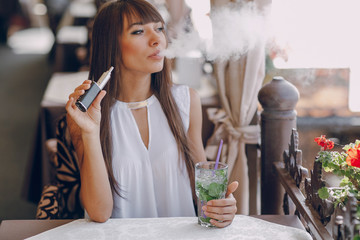 girn in cafe with E-Cigarette