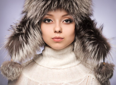 Portrait of a girl in a fur hat