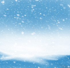 Winter christmas  background with snowdrifts and the falling snow