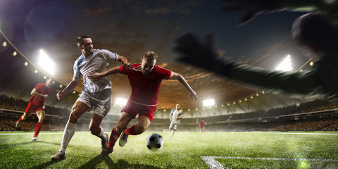 Soccer players in action on sunset stadium background panorama - obrazy, fototapety, plakaty