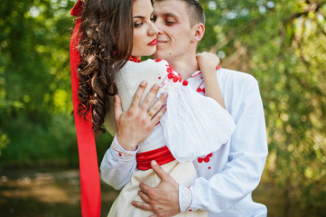 Obraz premium Love story of loving couple in national Ukraine dress.
