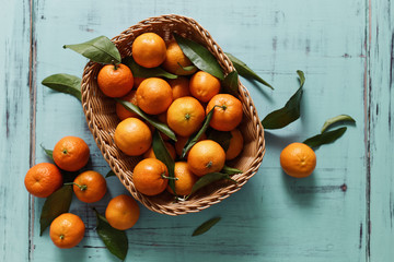 Basket of Tangerines on a wooden table
