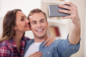 Portrait of cheerful friendly family with pretty big pet