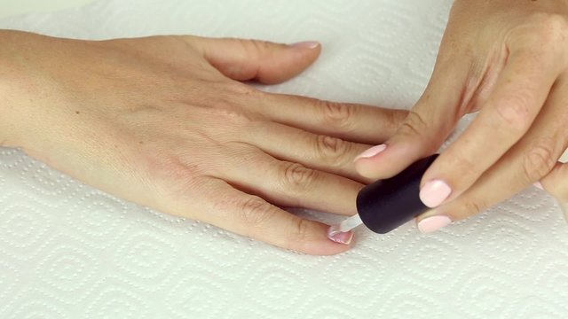Manicure in process - application gel polish base on clean female nails, preparing for color gel varnish