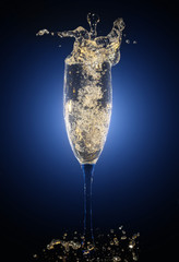 Glass of champagne with splashes