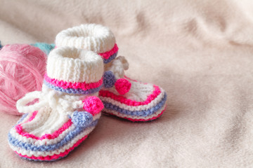 child booties on soft felt backgound