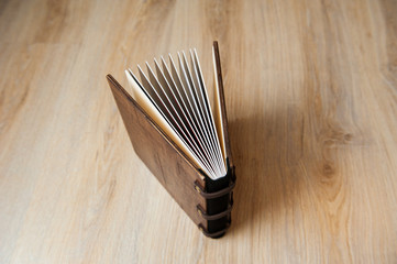 photo book in a brown wooden cover