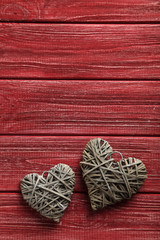 Love hearts on a red wooden background