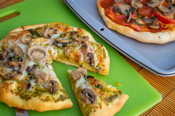 Freshly baked artisan pizza with fresh produce and cheese.