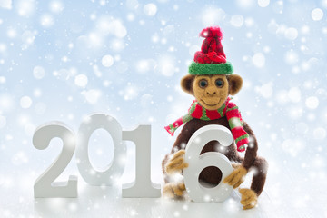 New Year 2016 the year of the monkey . Homemade toy monkey with a Christmas decorations .Symbol of 2016 New Year .