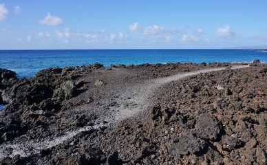 Black lava fields in the Ahihi-Kinau Natural Area Reserve, on the West shore of Maui