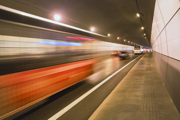 Fototapeta na wymiar Traffic rushing trough a tunnel