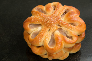  Taro bread with sesame on black  background