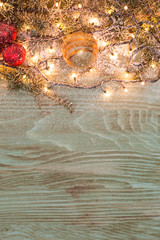 Christmas fir tree with snowfall on a wooden board