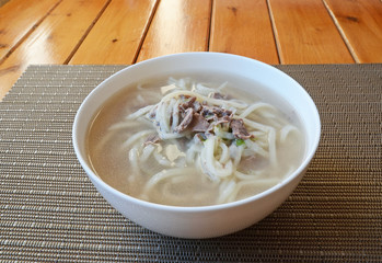 Traditional Mongolian cuisine. Soup with homemade nuddles and lamb