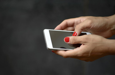 Cell Phone in Woman Hands, Sending Text Messages or Surfing the Web