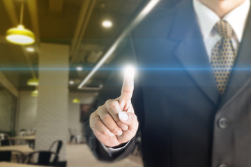 Businessman standing hand touch screen. You can add text to your ad.