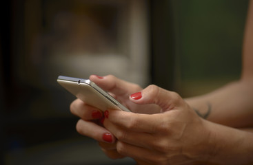 Cell Phone in Woman Hands, Sending Text Messages or Surfing the Web 