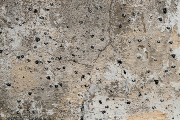 Textured walls with dirt.