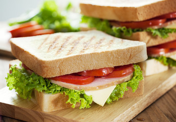 sandwiches on wooden board for breakfast