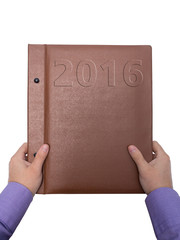 Hands holding diary for 2016