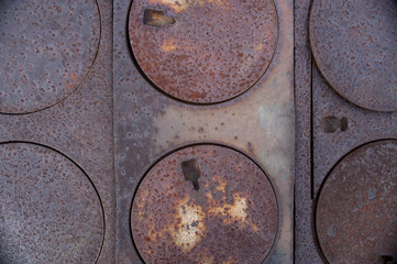 Series of round burner plates on pioneer, wood burning  stove 