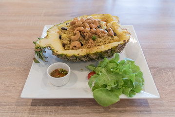 Pineapple Fried Rice on wooden table