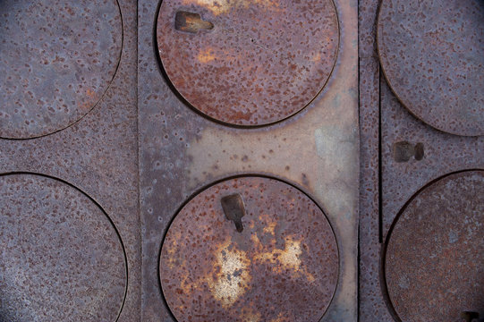 Series of round burner plates on pioneer, wood burning  stove 